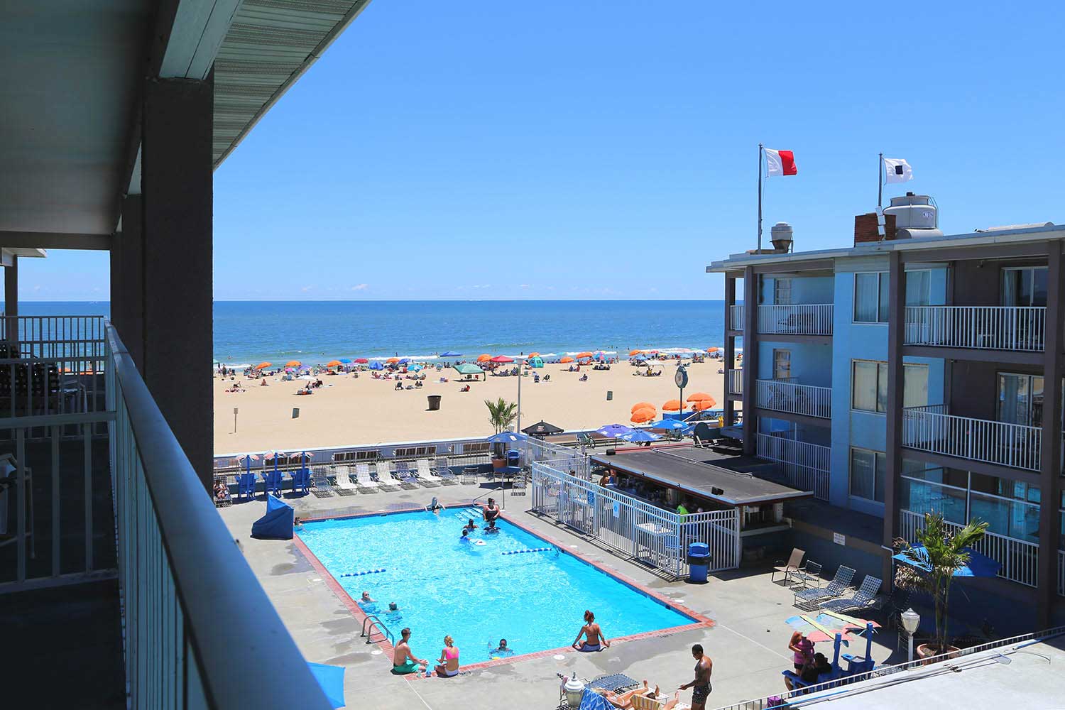 view of the courtyard and beach from balcony